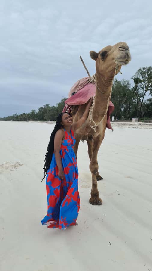 DIANI: BEACH CAMEL RIDE - Getting settled on the camel