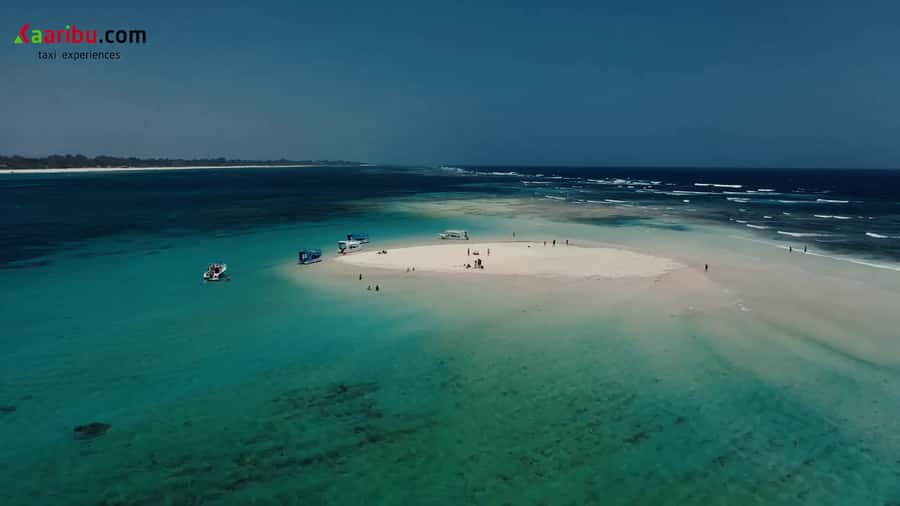 Diani Beach: Glass-Bottom Boat Cruise to Robinson Island - Snorkeling with help from the captain