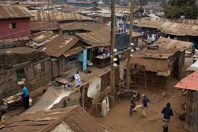 Kibera Slum Experience with Local Guide Born There - Seeing butcher bones turned into beads