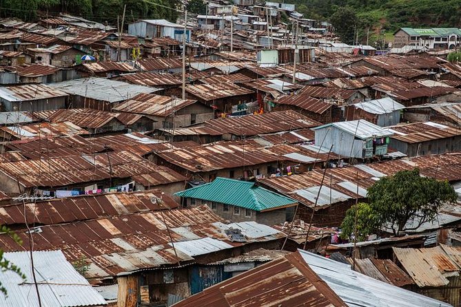 Kibera Slum Guided Tour from Nairobi - Water vendors, shower shops, and daily services
